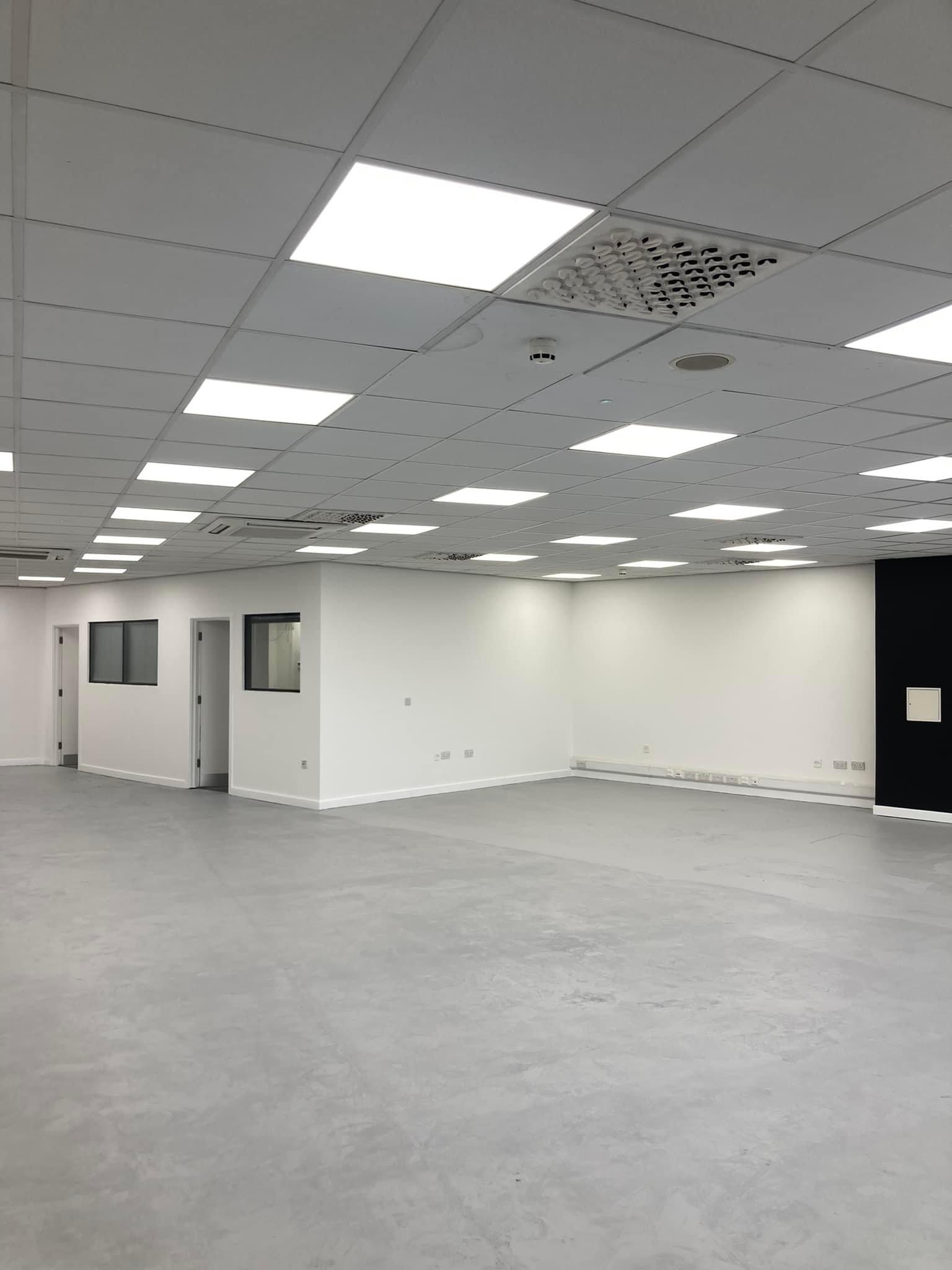 Large open-plan office freshly painted white