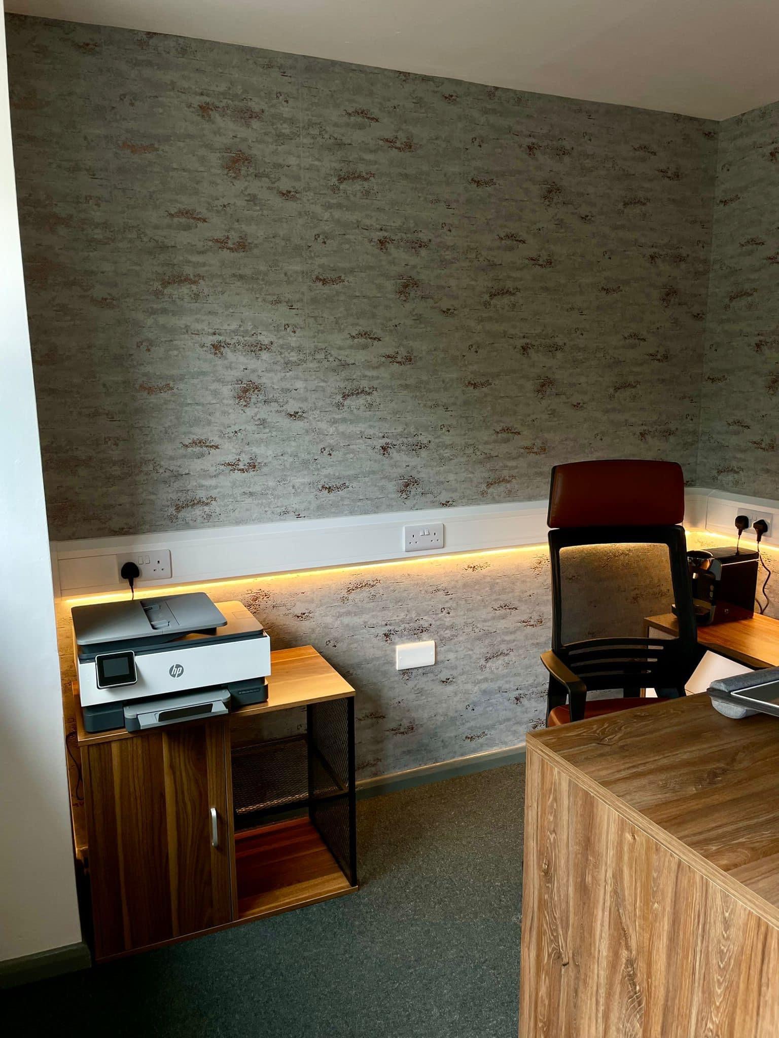 Home office finished in brick-effect wallpaper